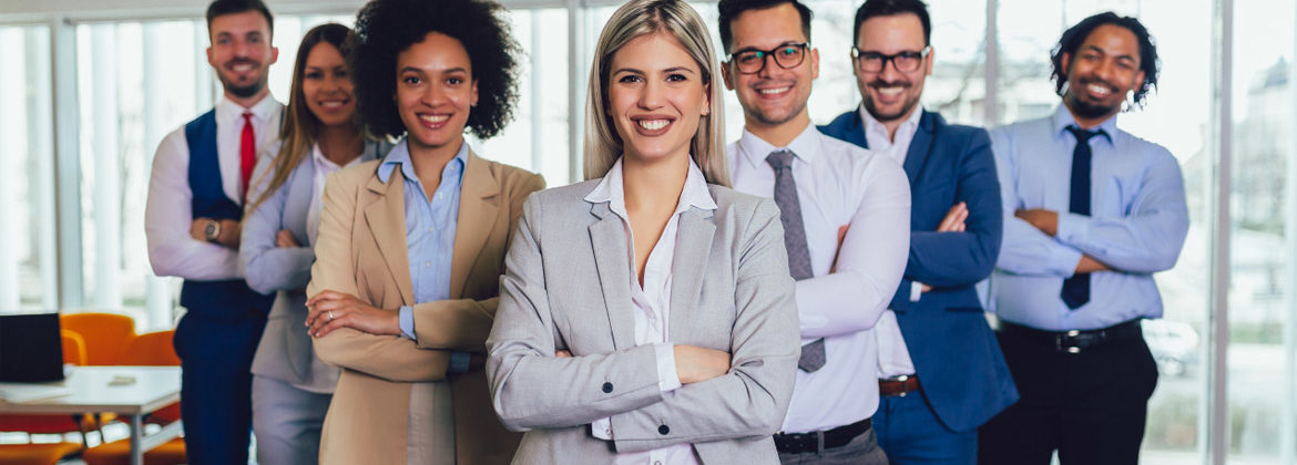 Small team standing together in the office