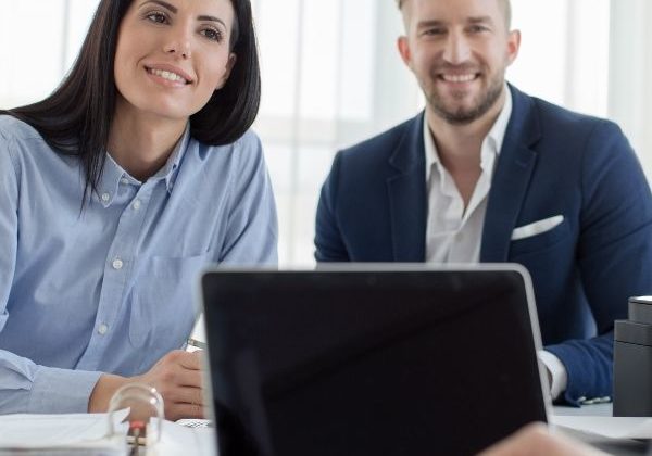 Couple meeting with title agent